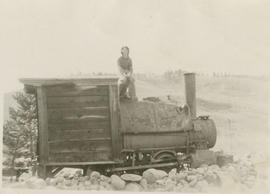 Young Eva Anderson on an abandoned boiler at the Silverthorn Mine near Breckenridge