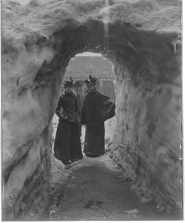 People look through a snow tunnel on Main Street, Breckenridge