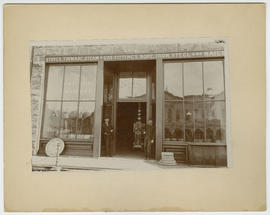 Charles Finding in the doorway of his hardware store on Main Street, Breckenridge