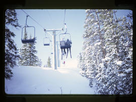 Skiers ride the chairlift at Breckenridge ski area