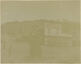 A man outside the Ten Mile Mercantile Company building in Recen