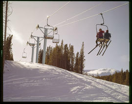 Skiers ride the chairlift on Peak 8 of the Breckenridge ski area