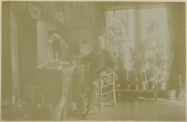 Frank Willis at a desk in his house in Breckenridge