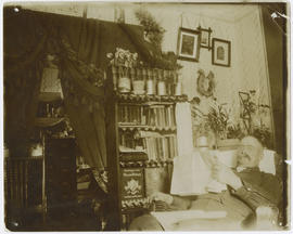 James W. Swisher reads the newspaper in his Breckenridge home