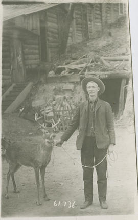 Carl Fulton and a deer outside the Hot Air Mine, near Breckenridge