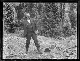 John Marks throws a stick in a forested area